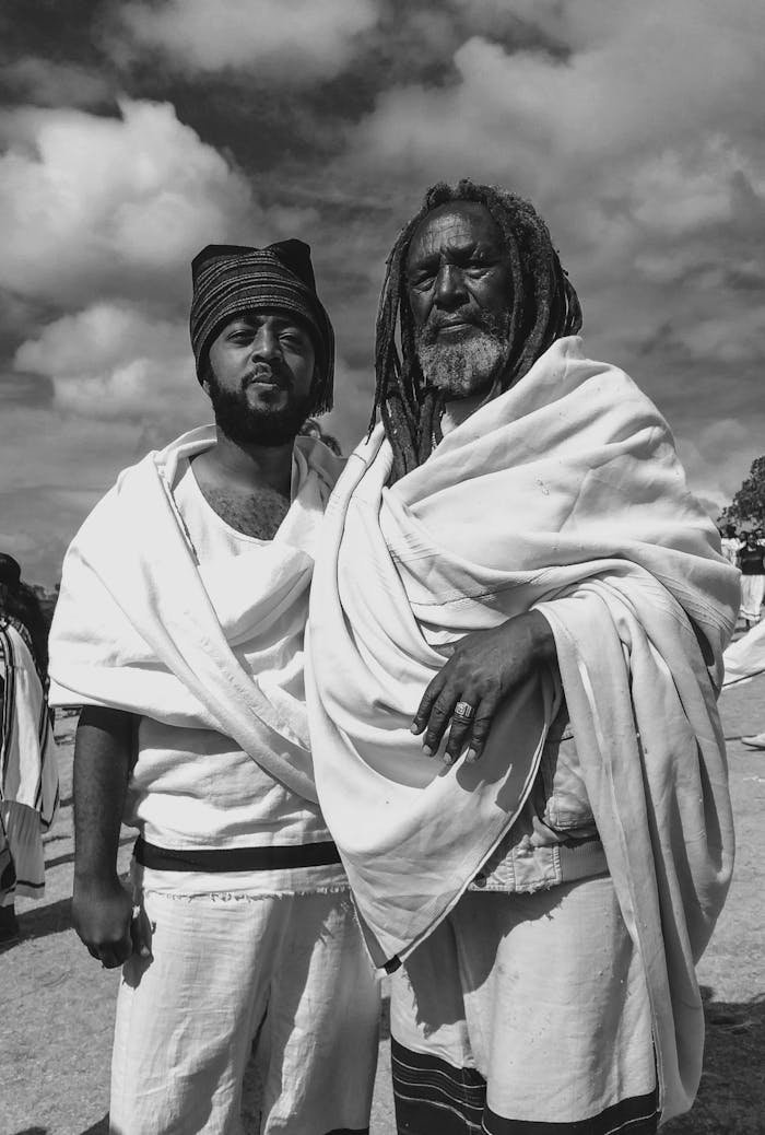 Men in Traditional Clothing in Black and White